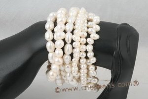 8 mixed size white pearl wristbands