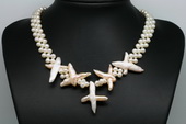 Pn607 Hand Woven White Seed Pearls with Large Cross Pearl